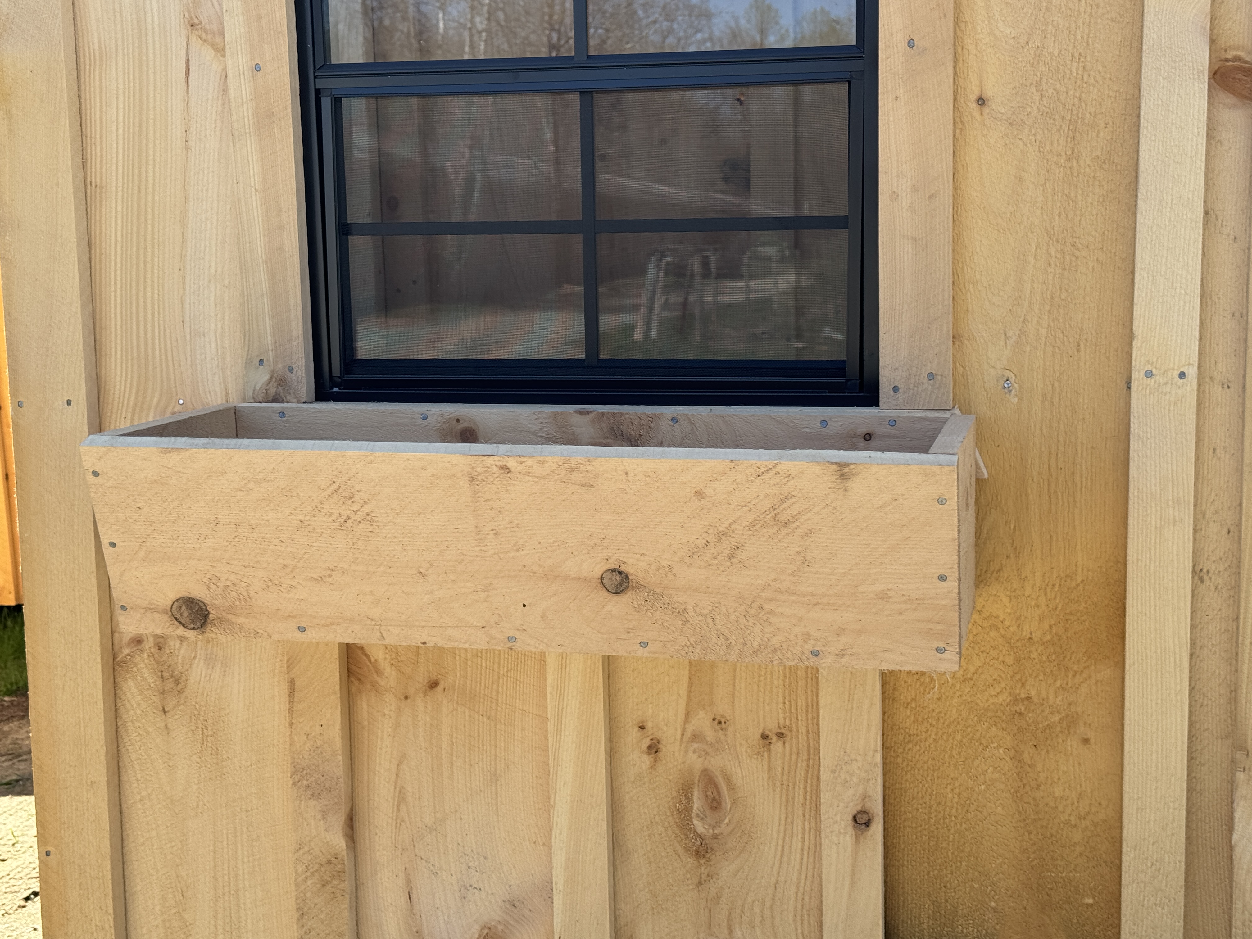 Shed with flower boxes and shutters